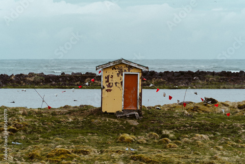 Fishing shack in coastal landsacape in southwest Iceland  photo