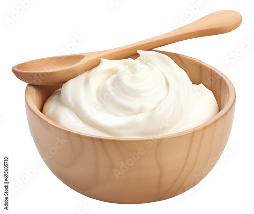 Sour cream in wooden bowl and spoon isolated. photo
