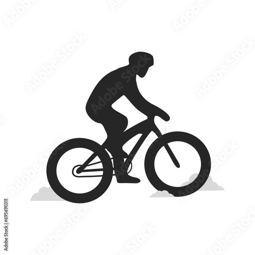 Winter fat biking on snow. Mountain bike sport on dirt road. Fat tire biker.