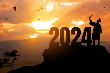 2024 New Year resolution.Silhouette Young man Graduation in 2024 years, education congratulation concept, Freedom and Happy New Year, success in the future goal and passing time. Start a new life.
