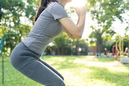 health care female exert on the park. Asian woman doing exercises in morning. balance, recreation, relaxation, calm, good health, happy, relax, healthy lifestyle, reduce stress, peaceful, Attitude. photo