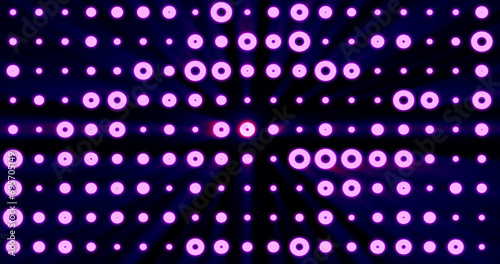 Abstract background of bright purple glowing light bulbs from circles and dots of energy magic disco wall