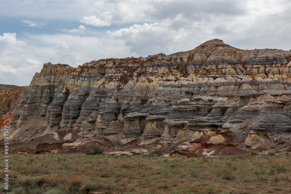 A picturesque canyon made of compressed clay, stones and sand in the South-East of Kazakhstan in the vicinity of the city of Aktau on a cloudy day