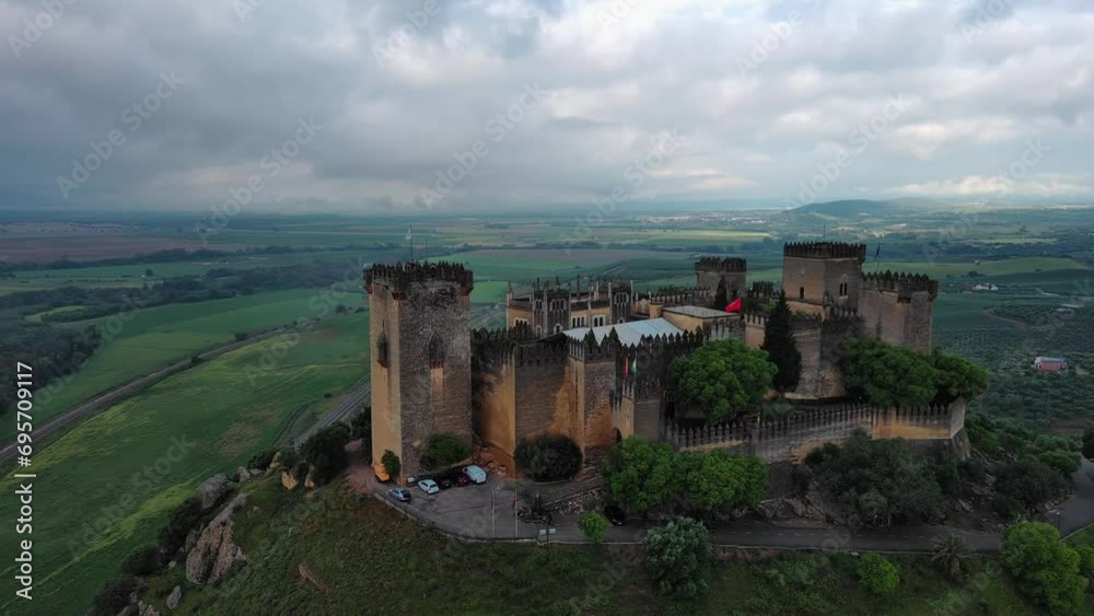 Splendid drone view of Almodovar del Rio Castle on cloudy day, Cordoba Splendid drone view of Almodovar del Rio Castle on cloudy day, Cordoba