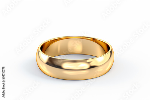 a gold wedding ring on a white surface