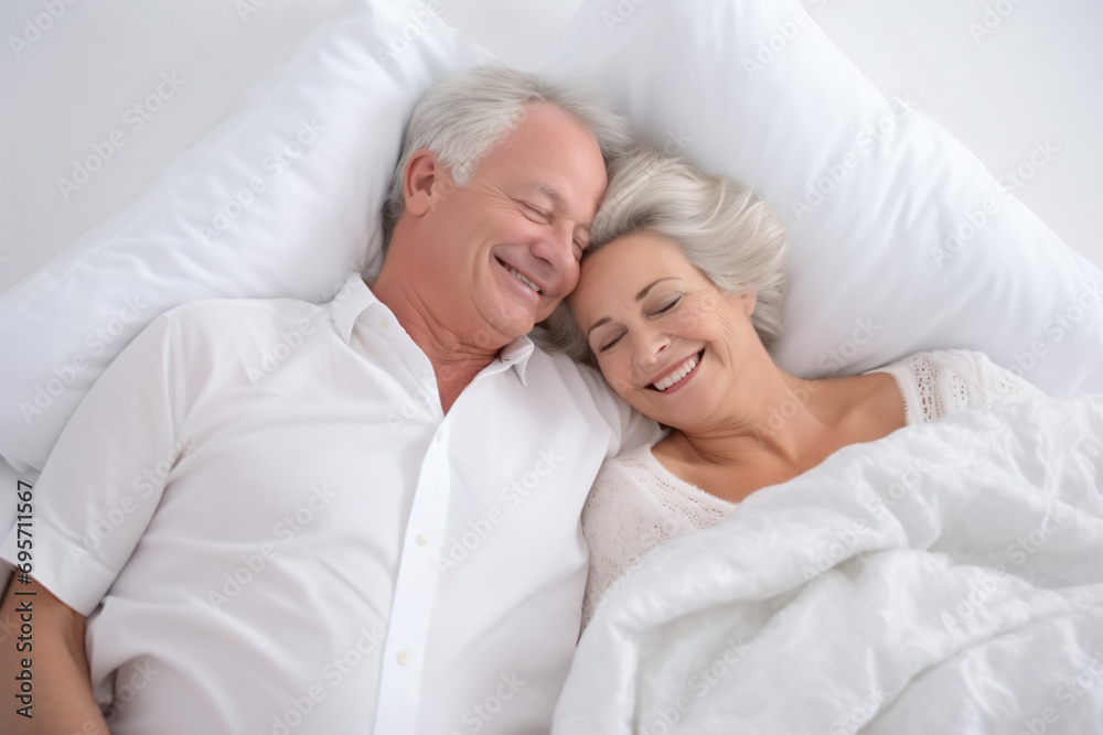 a man and woman laying in bed together