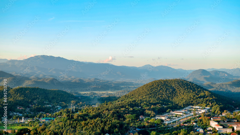 The city view of Mae Hong Son with mountains surrounding it is a beautiful landscape.
