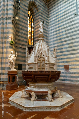 Orvieto, Italy - 18 November, 2023: side chapel and altar in the hsitoric Orvieto Cathedral photo