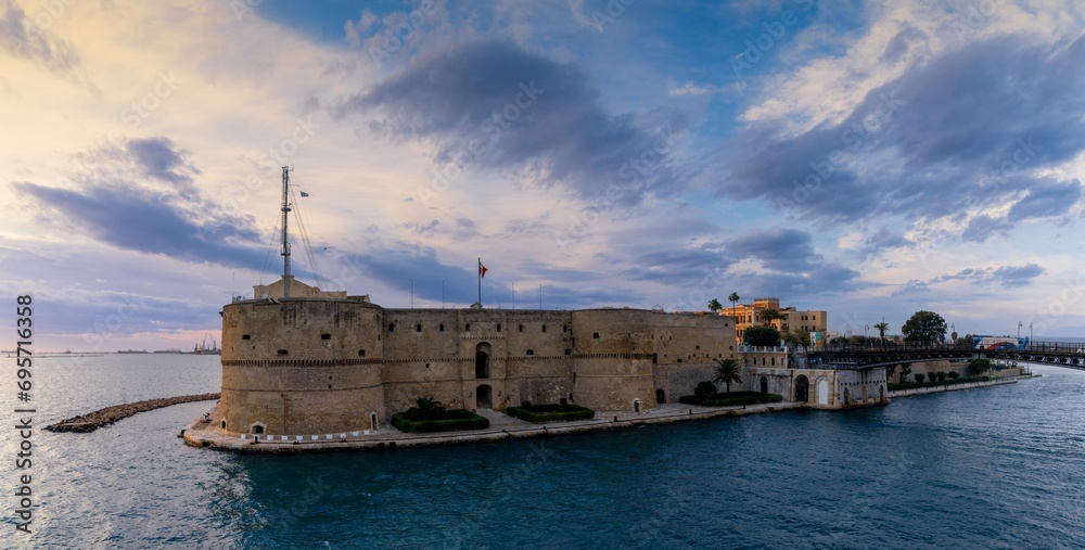 view of the Castello Aragonese fortress in the harbor of Taranto in Apulia