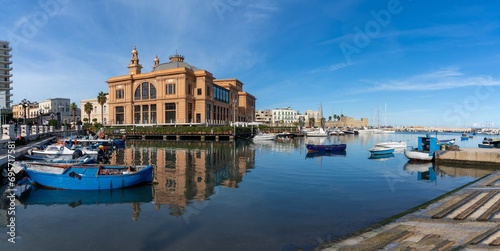 view of the historic Teatro Margherita building and fishermen harbour in Bari Vecchio photo