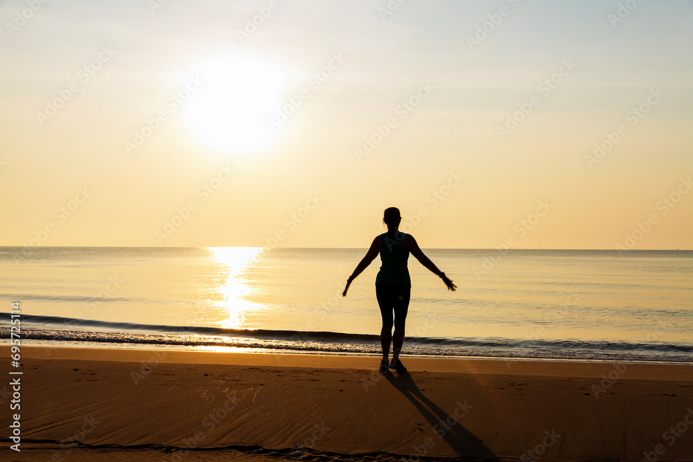 Woman exercise with sunrise at beach Bang Boet