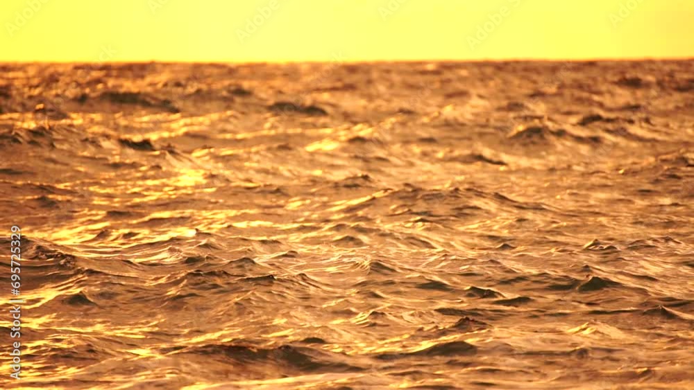 Abstract nautical summer ocean sunset background with blurred waves, sun reflections, and bokeh. Seamless panorama and sky replacement enhance the serene beauty of the golden sea.