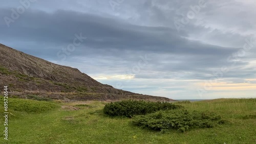 A calm and cloudy summer evening on the shores of the Barents Sea in the Varanger Peninsula, Northern Norway photo