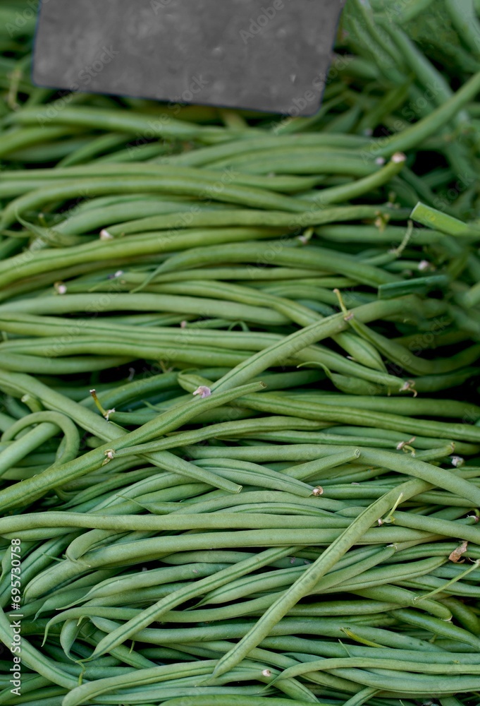 Fresh green beans are sold at the market. fresh vegetables in basket. with the concept of vegetables sold in traditional markets. Fresh green beans are sold at the market. fresh vegetables in basket. with the concept of vegetables sold in traditional markets.