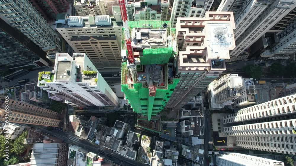 City skyview in 4K Aerial drone shot of the Mid-Levels, is an affluent residential area in Hong Kong, located between Victoria Peak and Sheung Wan Central. Residents are affluent and expatriate profes City skyview in 4K Aerial drone shot of the Mid-Levels, is an affluent residential area in Hong Kong, located between Victoria Peak and Sheung Wan Central. Residents are affluent and expatriate profes