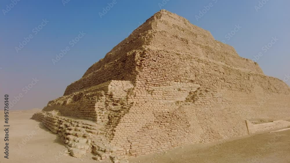 Saqqara, Egypt: Exterior view of the famous Djoser step pyramid in the Sakkara necropolis near Cairo in Egypt is the oldest large pyramid dating to 4500 years. Saqqara, Egypt: Exterior view of the famous Djoser step pyramid in the Sakkara necropolis near Cairo in Egypt is the oldest large pyramid dating to 4500 years.