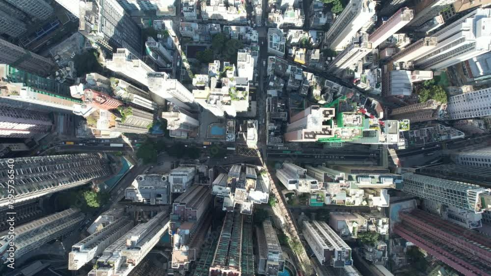 City skyview in 4K Aerial drone shot of the Mid-Levels, is an affluent residential area in Hong Kong, located between Victoria Peak and Sheung Wan Central. Residents are affluent and expatriate profes City skyview in 4K Aerial drone shot of the Mid-Levels, is an affluent residential area in Hong Kong, located between Victoria Peak and Sheung Wan Central. Residents are affluent and expatriate profes