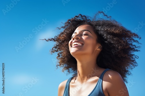 Stock photography of a black African American woman. Mind. Launching, blue sky background photo