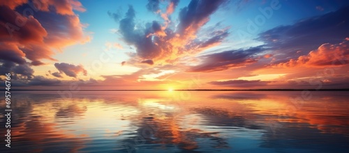 Gorgeous tranquil landscape: sunset, sky, clouds, water. photo