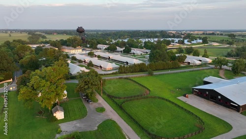 Horse farm in Kentucky during summer. Aerial view of barns and equestrian farm in USA. photo