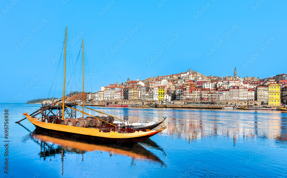 Portugal - Porto old town panoramic view at riverfront  - Rabelo boat sightseeing in Douro river, Oporto.