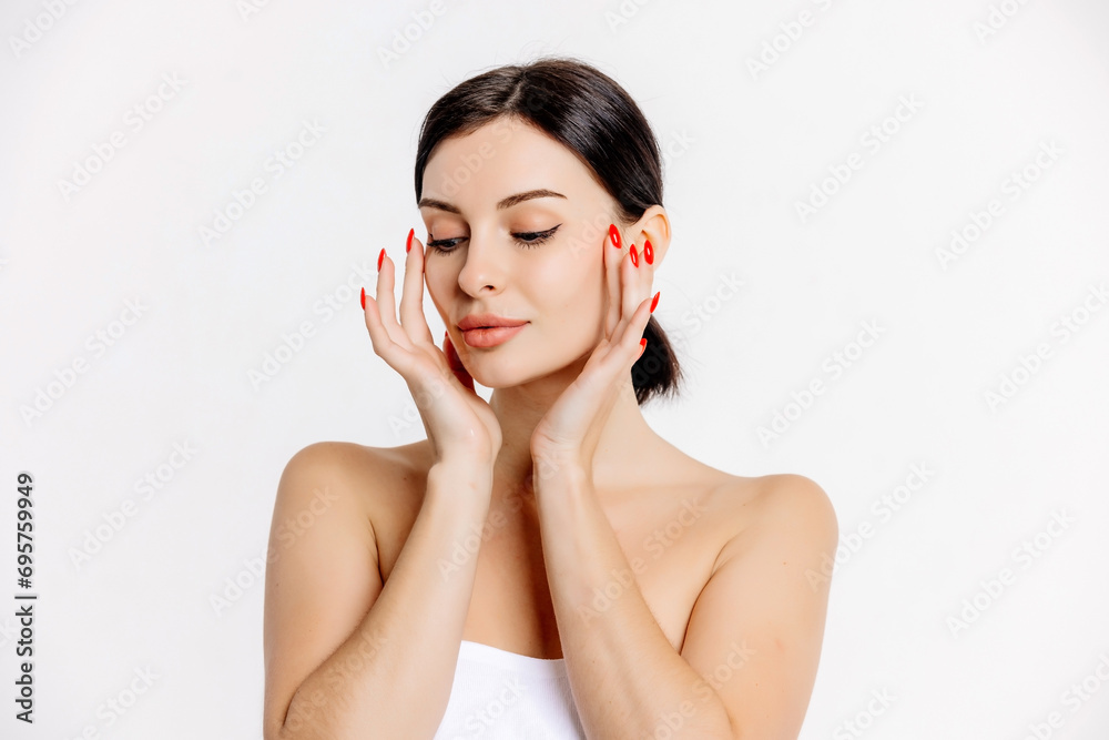 Beautiful woman face with blue eyes looking at camera, isolated on white studio background. Skin care treatment or cosmetic ads concept.Female model with perfect fresh and clean skin Beautiful woman face with blue eyes looking at camera, isolated on white studio background. Skin care treatment or cosmetic ads concept.Female model with perfect fresh and clean skin
