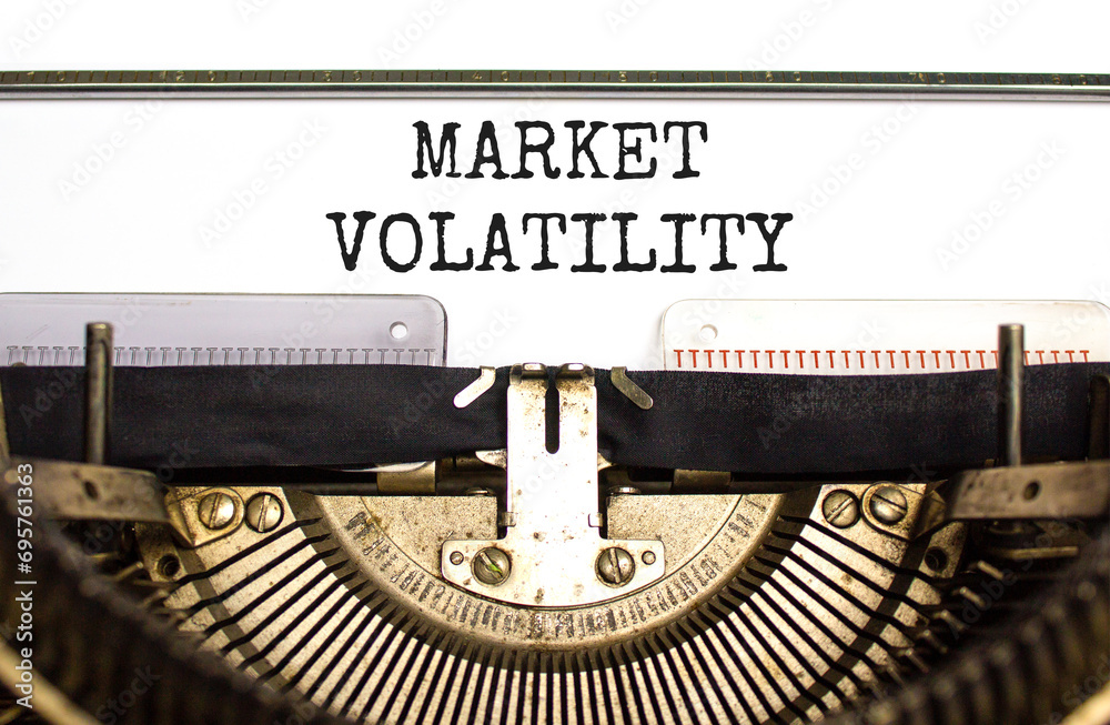 Market volatility symbol. Concept words Market volatility typed on beautiful old retro typewriter. Beautiful white paper background. Business market volatility concept. Copy space.orange