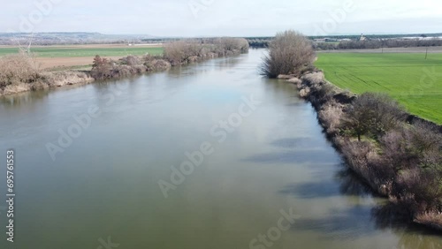 Vista de una pequeña cascada en el rio Duero a su paso por la provincia de Valladolid-España. Movimiento de camara a vista de dron photo