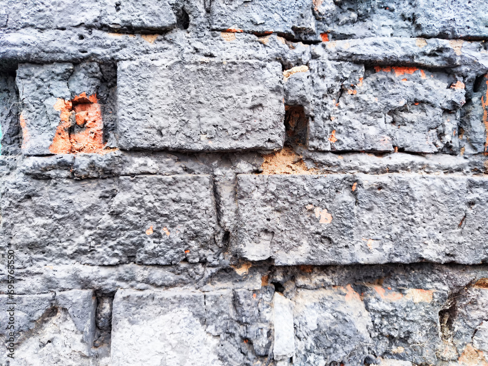 Background and texture with gray old brick and plaster remnants. Abstract background, texture, pattern, frame, place for text and copy space Background and texture with gray old brick and plaster remnants. Abstract background, texture, pattern, frame, place for text and copy space