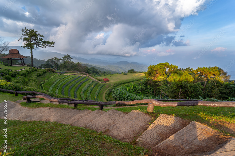 landscape and travel concept with stone ladder and cloudy sky with mountain layer background