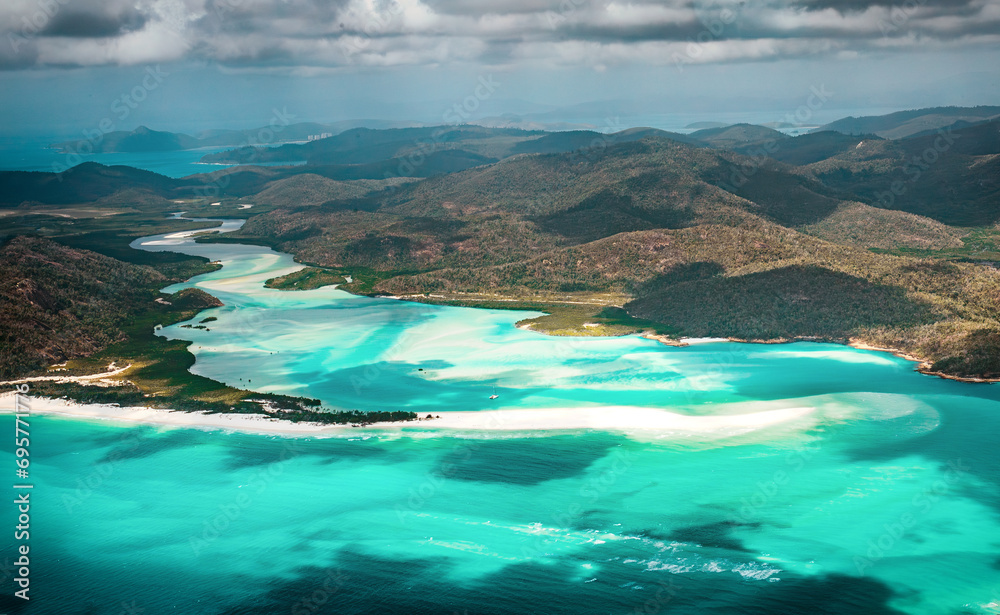 The aerial view of the Whitheaven Beach and Whitsunday Island from scenic helicopter