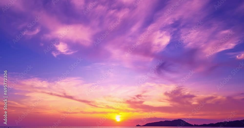 Beautiful 4K Time lapse of Majestic sunset or sunrise clouds sky over sea landscape,Amazing colorful light of nature cloudscape sunrise sky background