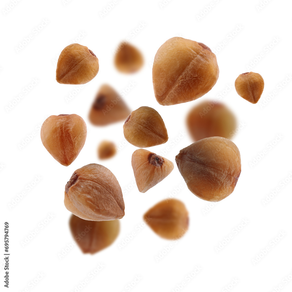 Buckwheat flying on white background. Grains in air Buckwheat flying on white background. Grains in air