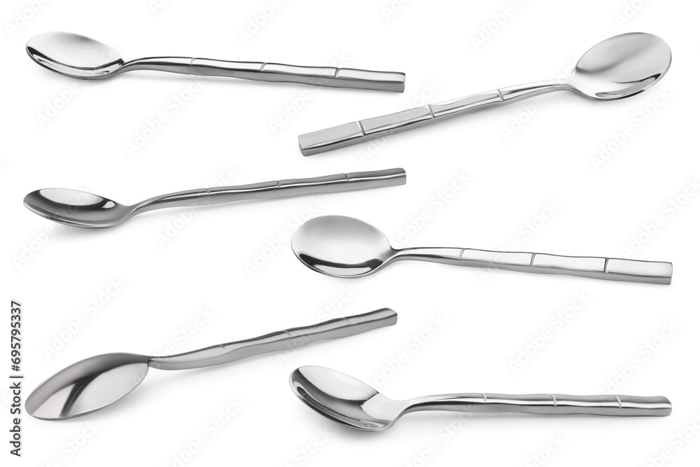 Silver spoon isolated on white, different sides. Kitchen utensil Silver spoon isolated on white, different sides. Kitchen utensil