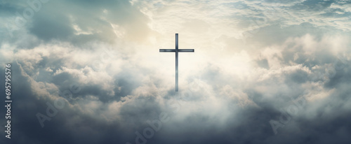 Cross in clouds symbol of the death and resurrection photo
