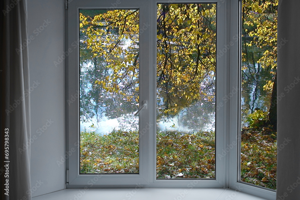 View from the window, yellow trees, landscape with lake, park view. View from the window, yellow trees, landscape with lake, park view.