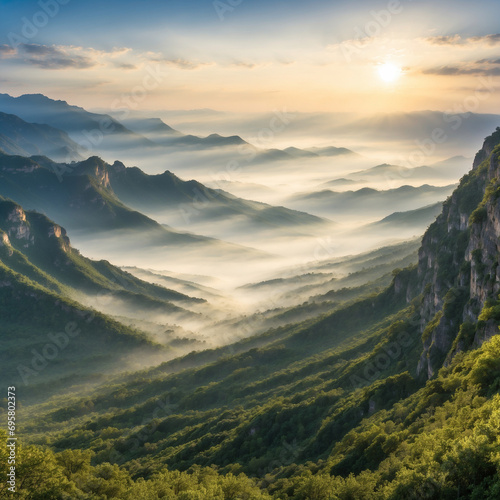 Rows of mountains at sunrise and with valleys filled with greenery seen from the edge of high cliffs. You can see the fog through the sunlight © M. Faisal Riza