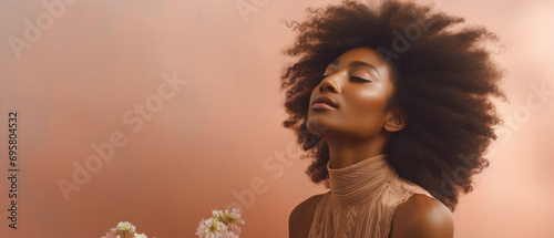 African american woman with afro hairstyle and flowers, panoramic shot photo
