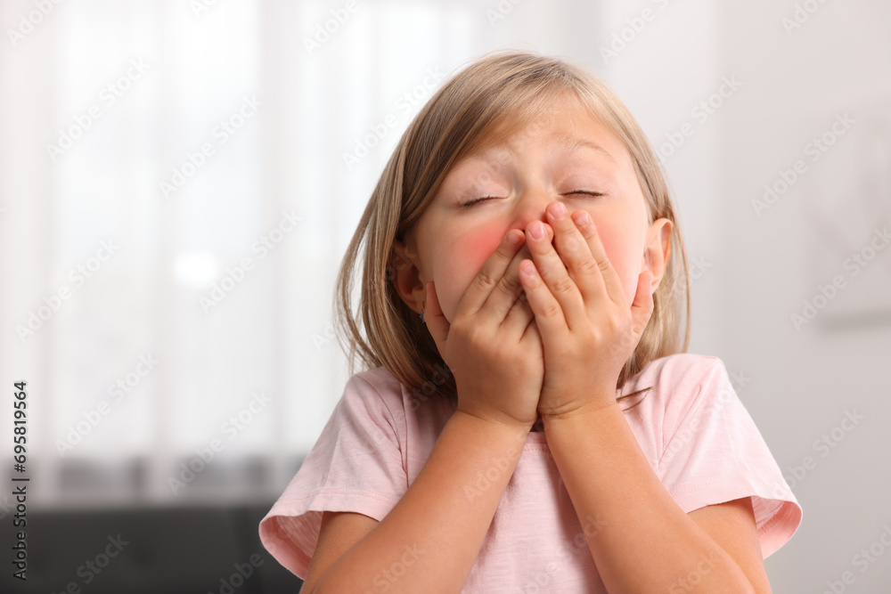 Suffering from allergy. Little girl sneezing at home, space for text Suffering from allergy. Little girl sneezing at home, space for text