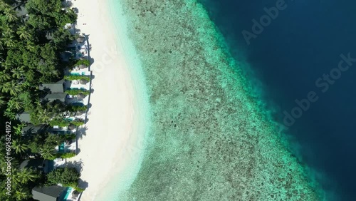 Tropical Island Paradise - Malahini Kuda Bandos, Maldives: Aerial drone full island beach and reef from above photo