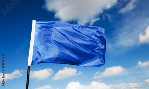 Blue flag waving on sky