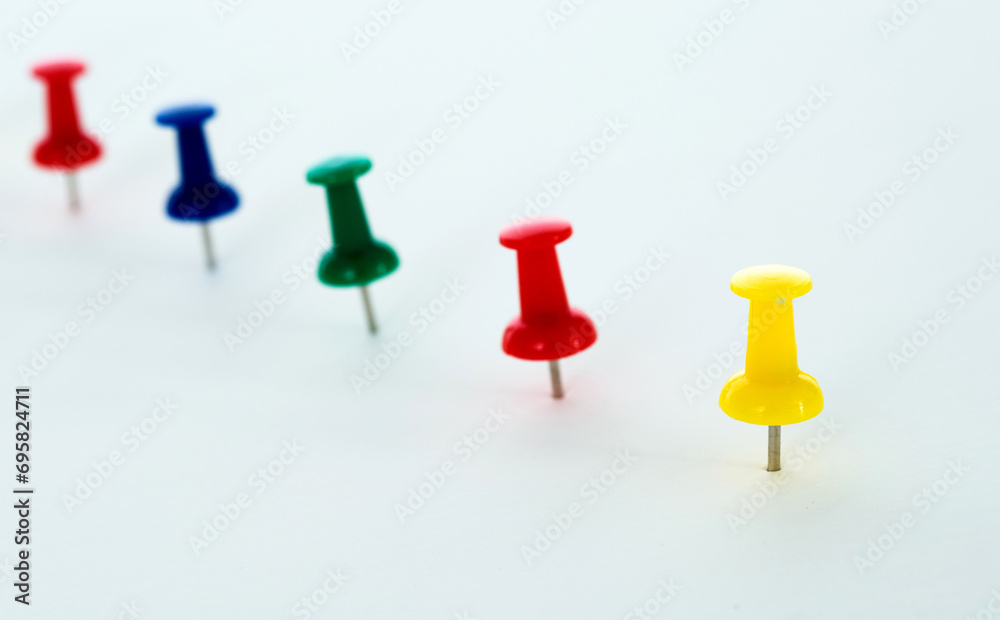 Push pins in a row isolated on white Push pins in a row isolated on white