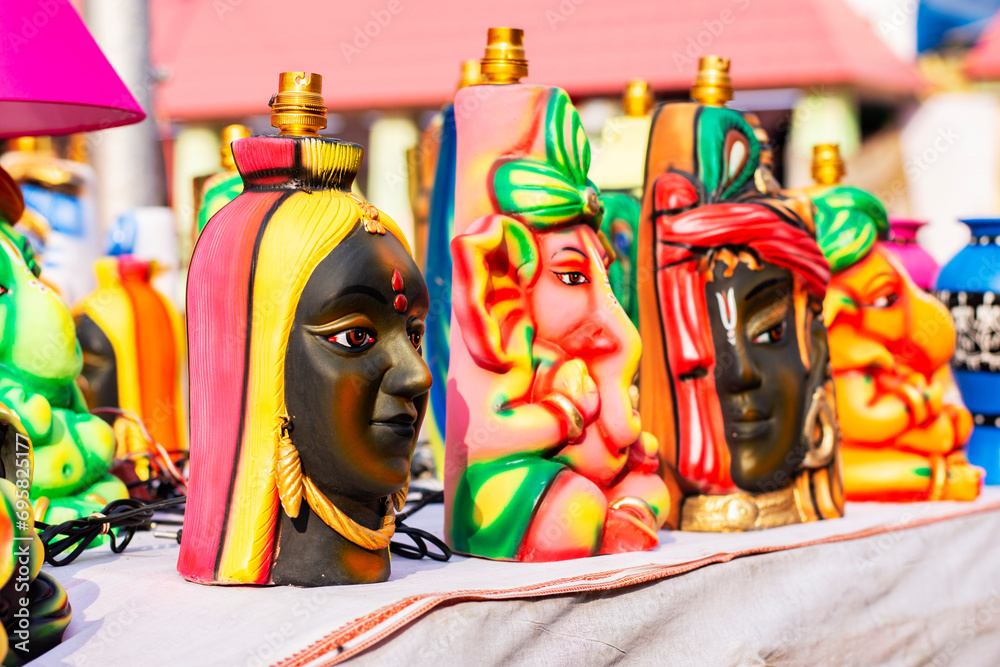 Beautiful idol of Lord Ganesha, works of handicraft, for sale during Handicraft Fair in Kolkata. Selective focus.