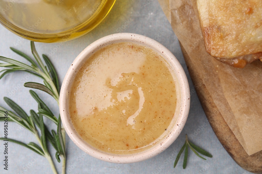 Delicious turkey gravy and rosemary on grey table, top view Delicious turkey gravy and rosemary on grey table, top view