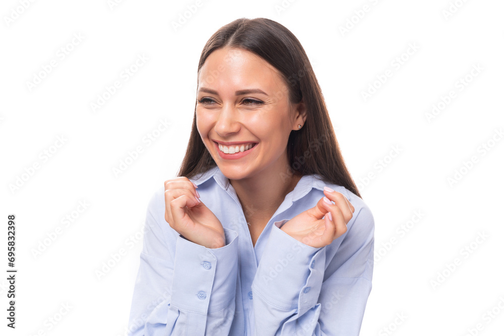 portrait of a young happy caucasian model woman with light makeup and dark straight hair dressed in a blue blouse feeling joy on a white background with copy space portrait of a young happy caucasian model woman with light makeup and dark straight hair dressed in a blue blouse feeling joy on a white background with copy space