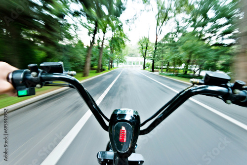 Riding on high speed electric bicycle in park