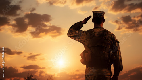 Silhouette of a soldier saluting at sunset, embodying respect, military honor, and patriotism in a serene evening backdrop photo