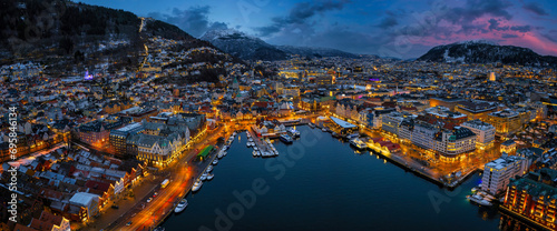 Panoramic aerial view of the illuminated cityscape of Bergen, Norway, during winter dusk time © moofushi