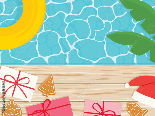 spending christmas in a different way on the tropcial vacation; swimming pool and gift boxes, santa hat and gingerbread cookies - vector illustration photo