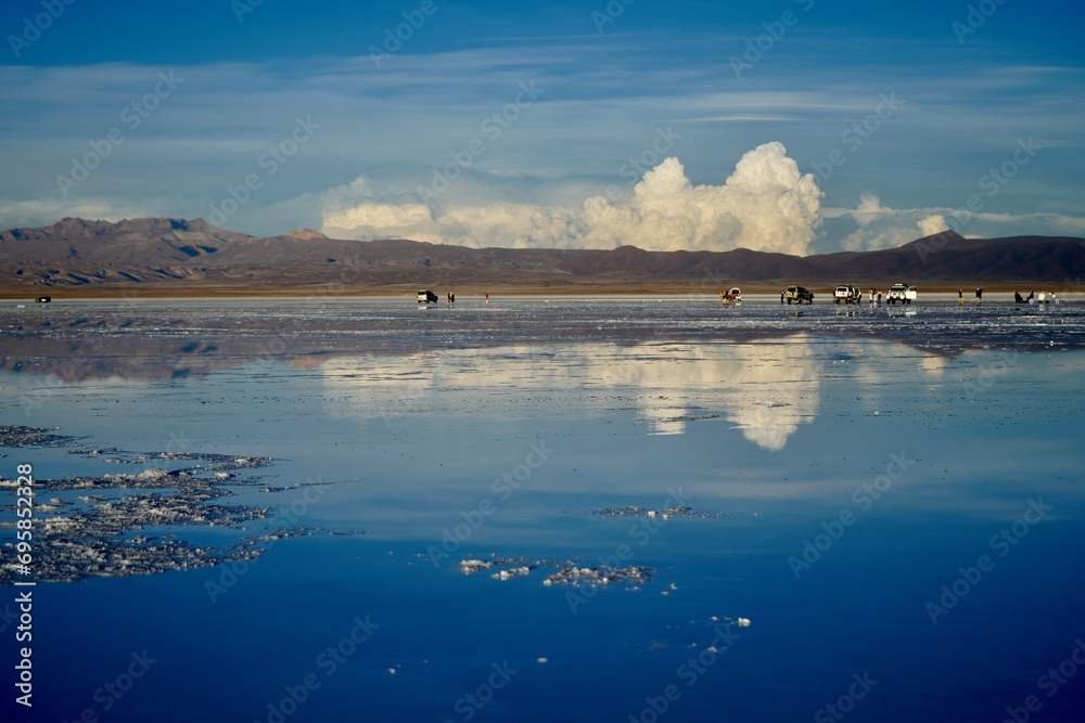 Clouds and Mountains reflected in shallow water on the Salt Flats, Uyuni Salt Flat, Bolivia.